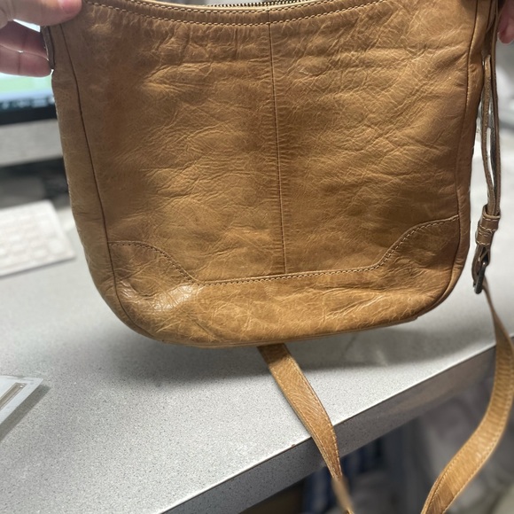 Used Frye crossbody purse. Tan in color good condition - Picture 3 of 4